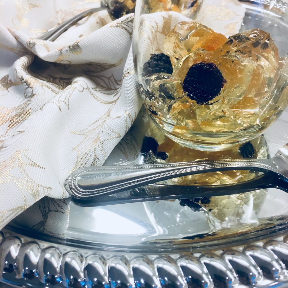 Prosecco gelée with berries in glasses