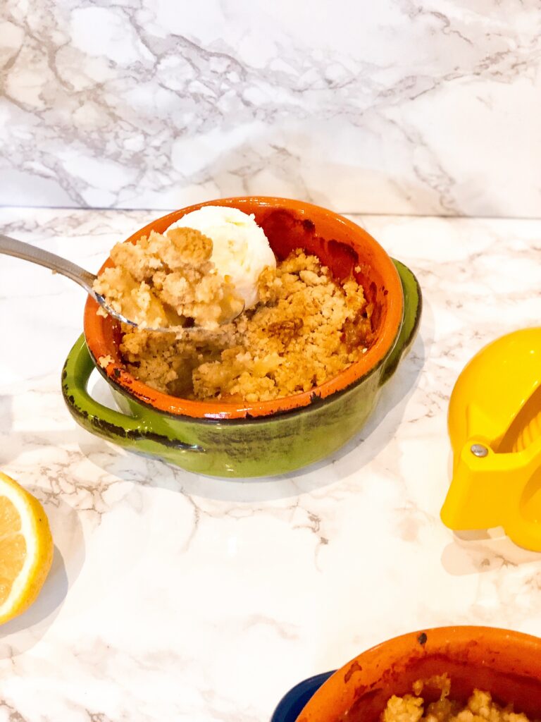 apple crumble in green serving pot