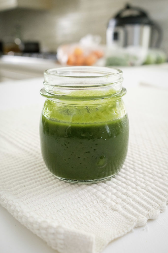 green food colouring in a glass jar