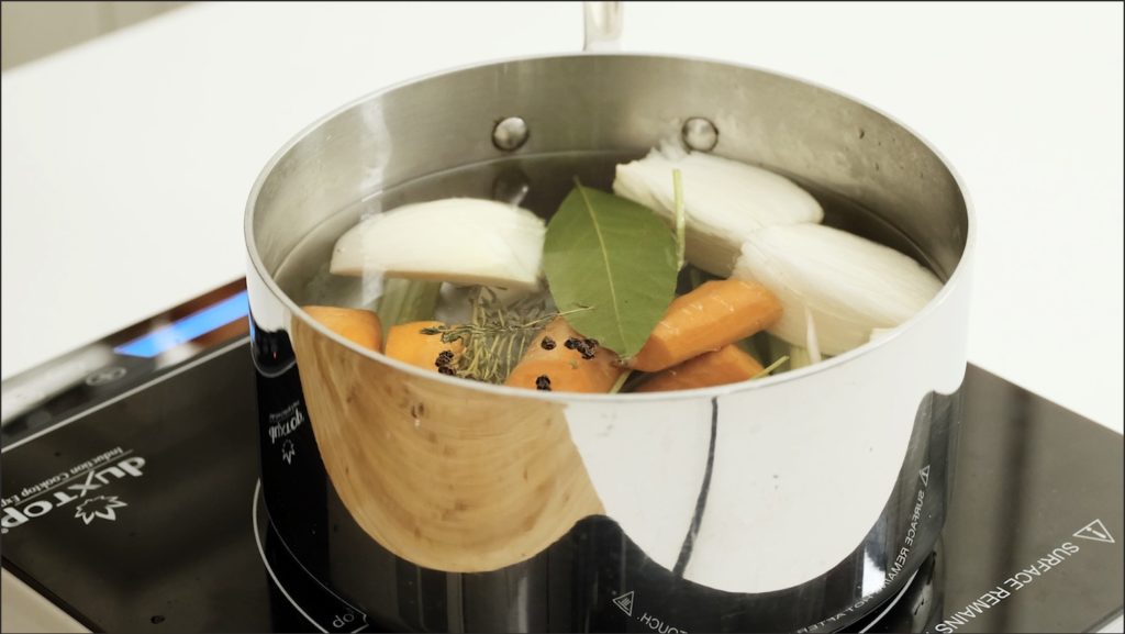 vegetable in a pot with water on the stove
