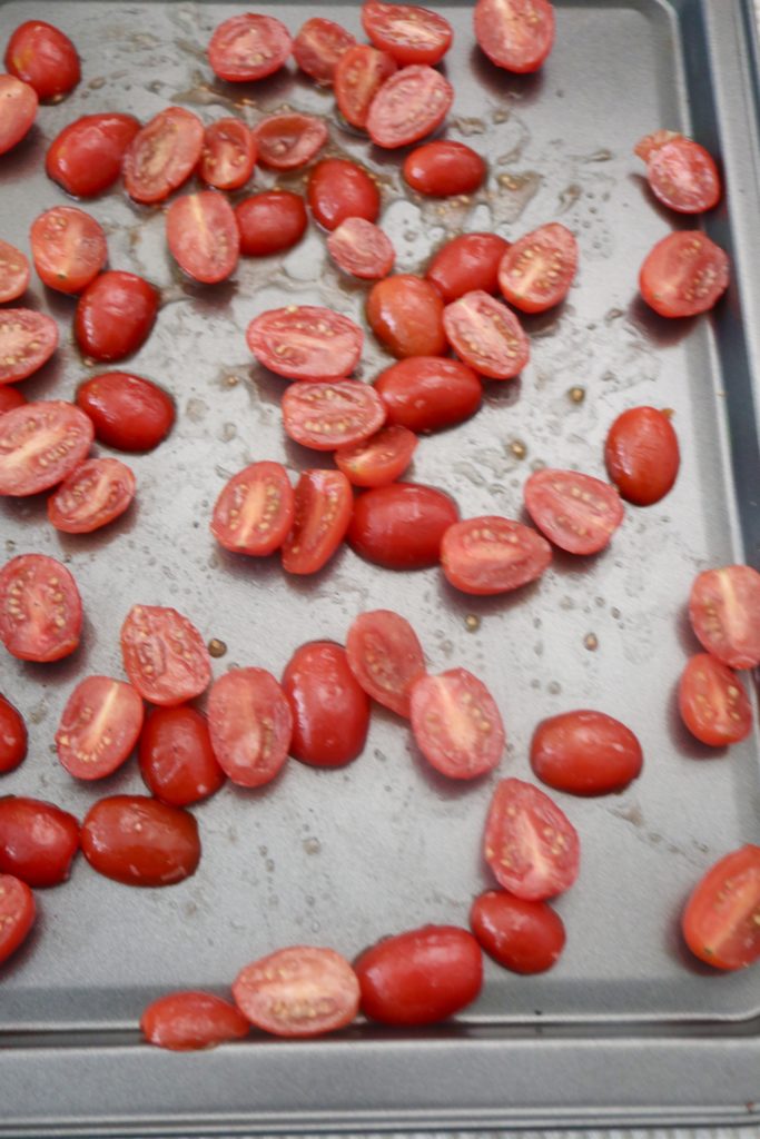 tomatoes halves on a baking sheet