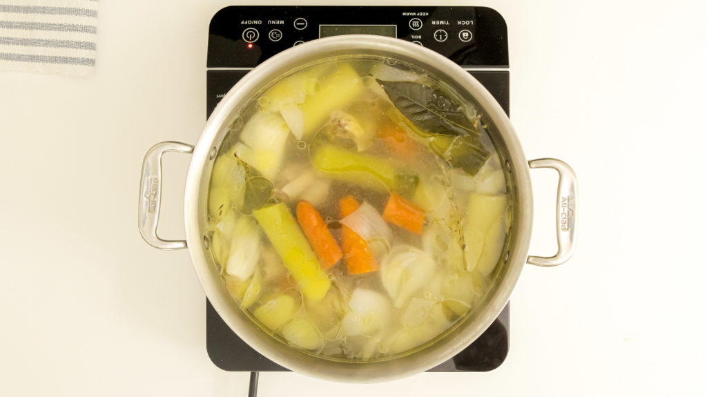 chicken broth on the stove