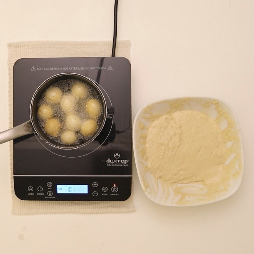 beignets in frying pan