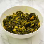 amaranth leaves stew in white bowl