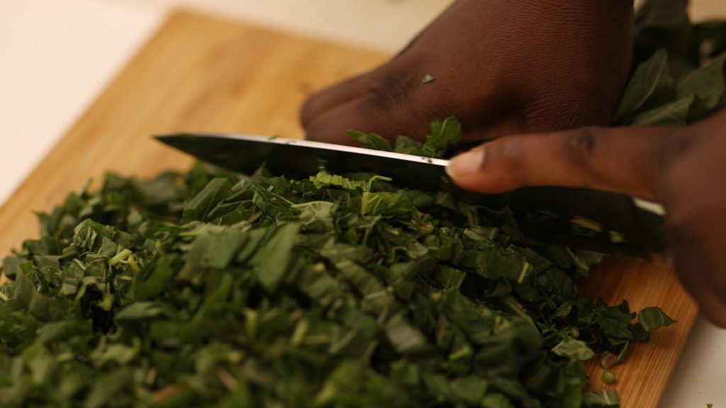 amaranth leaves being chopped