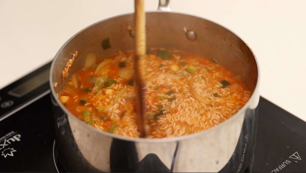 spicy rice in a pot on the stove