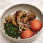 Red fufu with lamb chops on a grey bowl