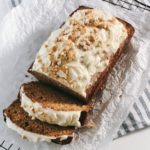 carrot cake sliced on parchment paper