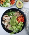 sorghum salad bowl with avocado, red pepper, green pepper, chicken, white beans