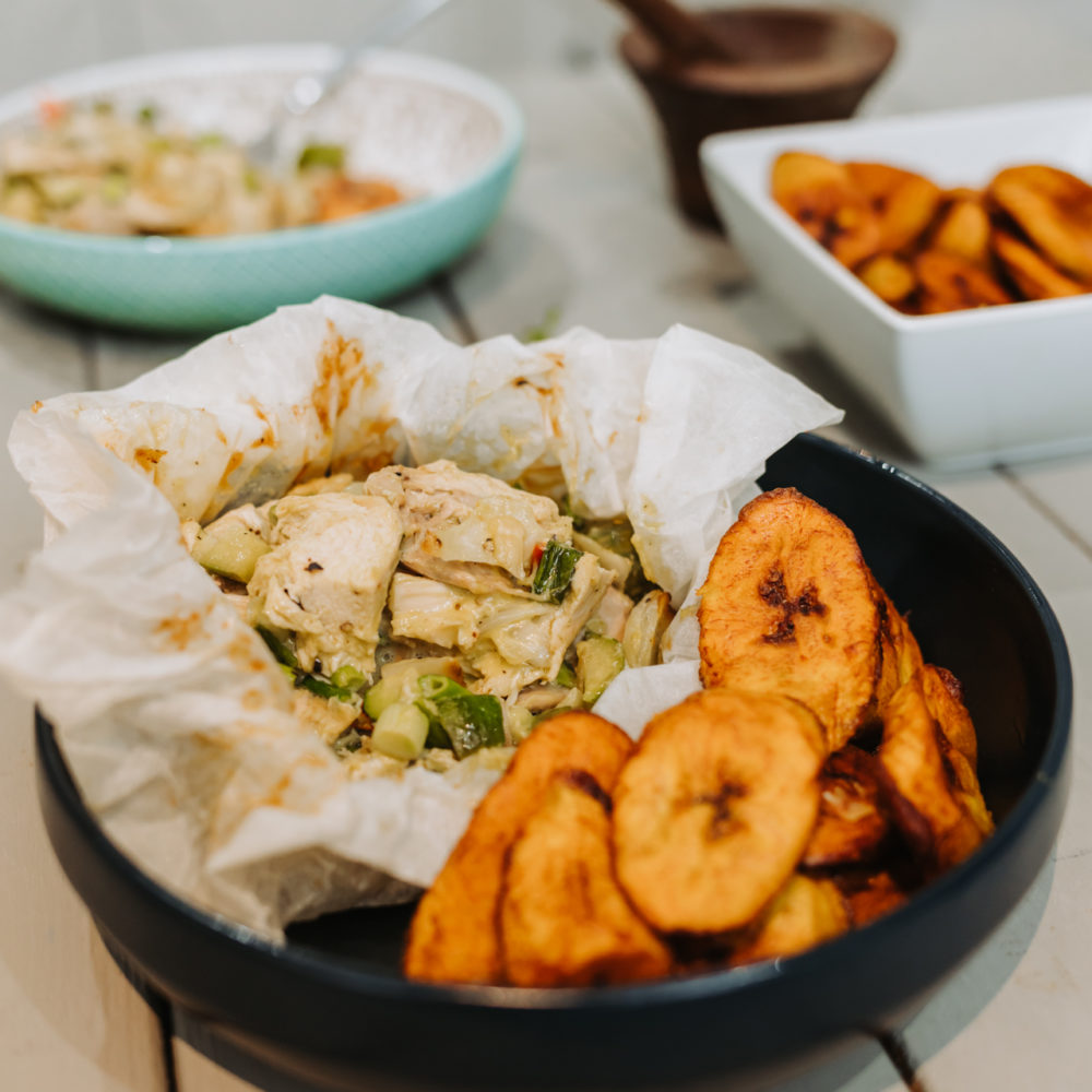 chicken with mayonnaise in a blue bowl with plantains