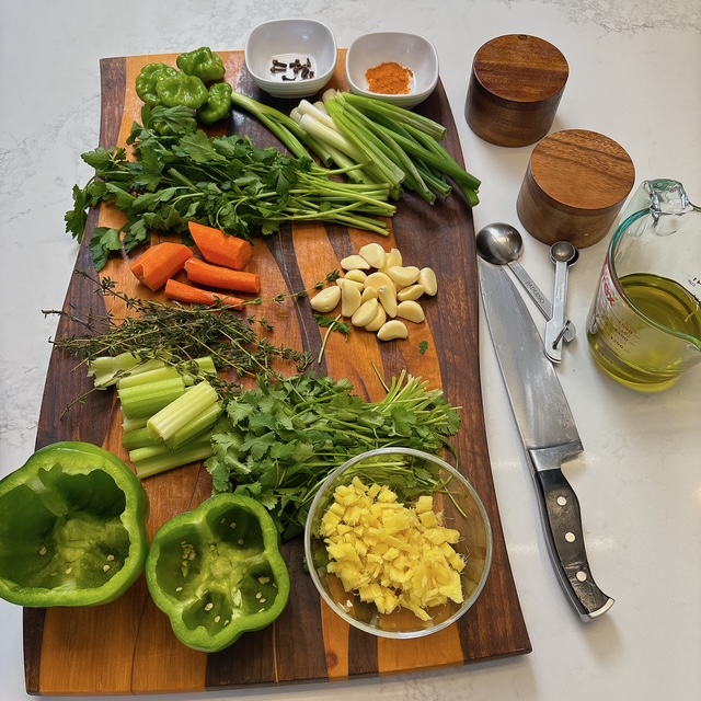 Spices and herb on a cutting board.
