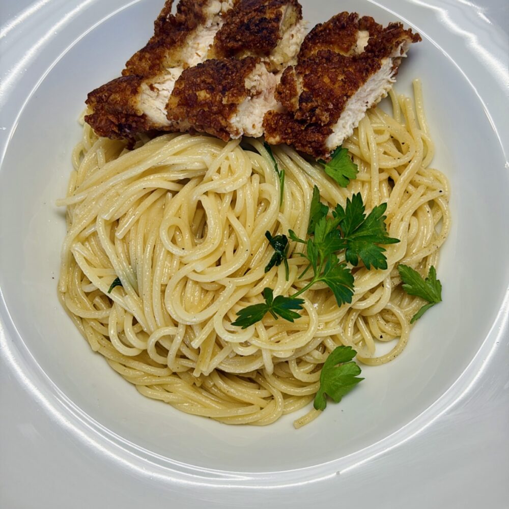 crispy chicken parmesan served over spaghetti